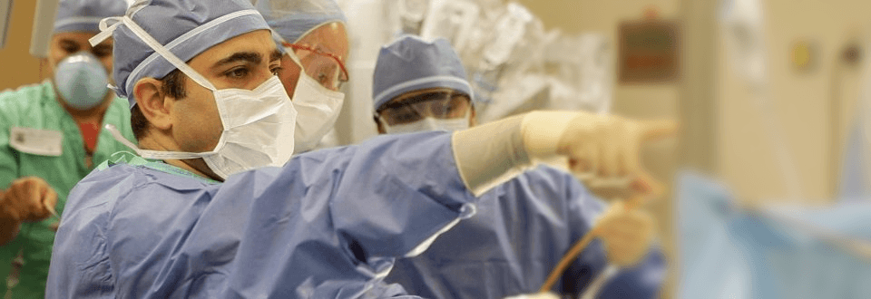 Dr. Kella directing surgery in the operating room at Baptist